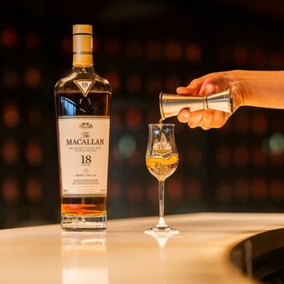 Macallan bottle next to a glass