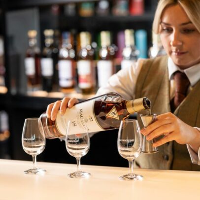 A Lady pours Macallan into a glass